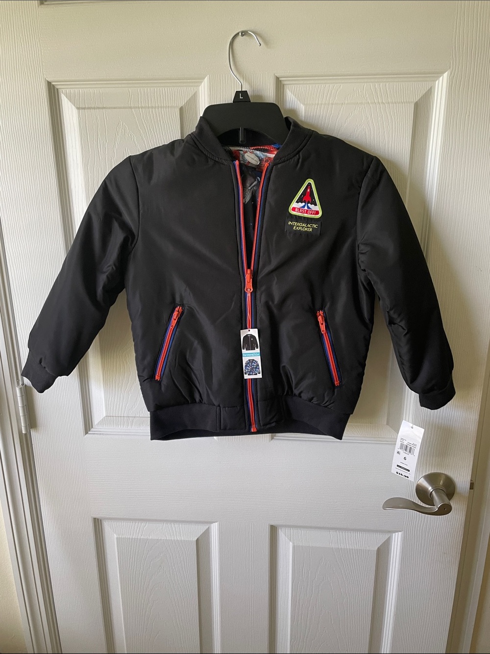 Boys light weight jacket brand new with tags it’s also reversible